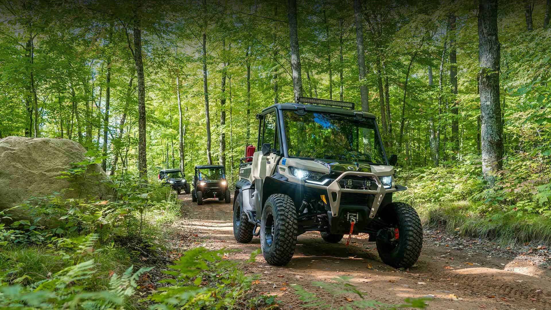 Three UTVs on a trail in Sawyer County, the Hayward Lakes area