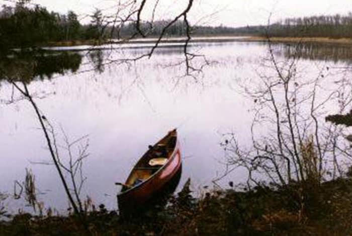 canoe on northwoods lake shore